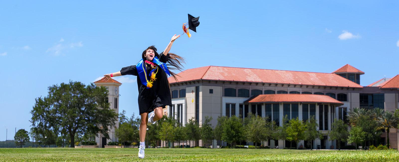 Erika尼尔森 throwing grad cap with joy